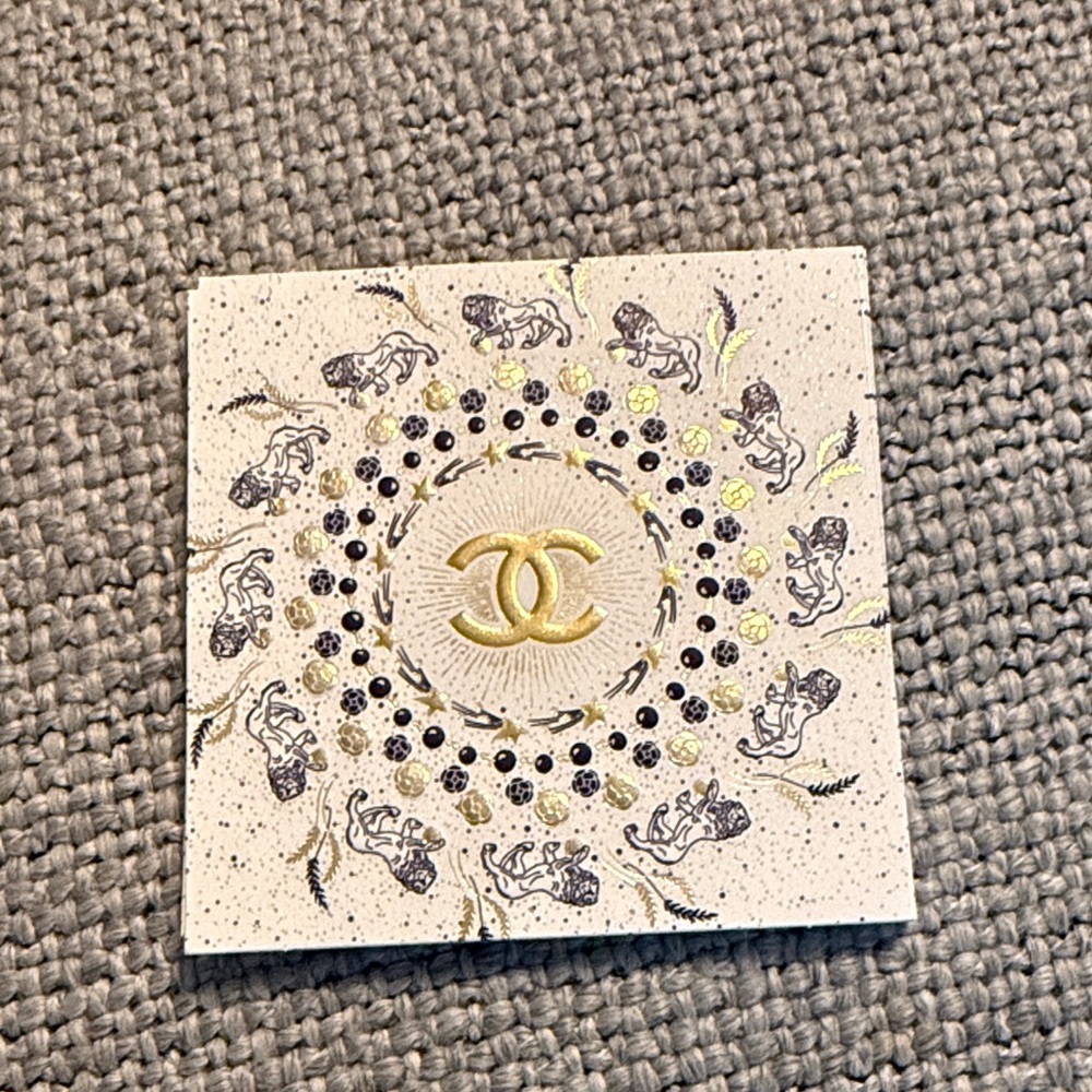 CHANEL Cream and Gold Zodiac Card